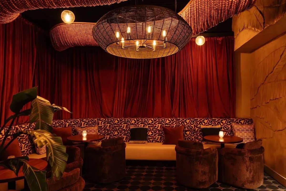 The bar lounge, curtained and lit low