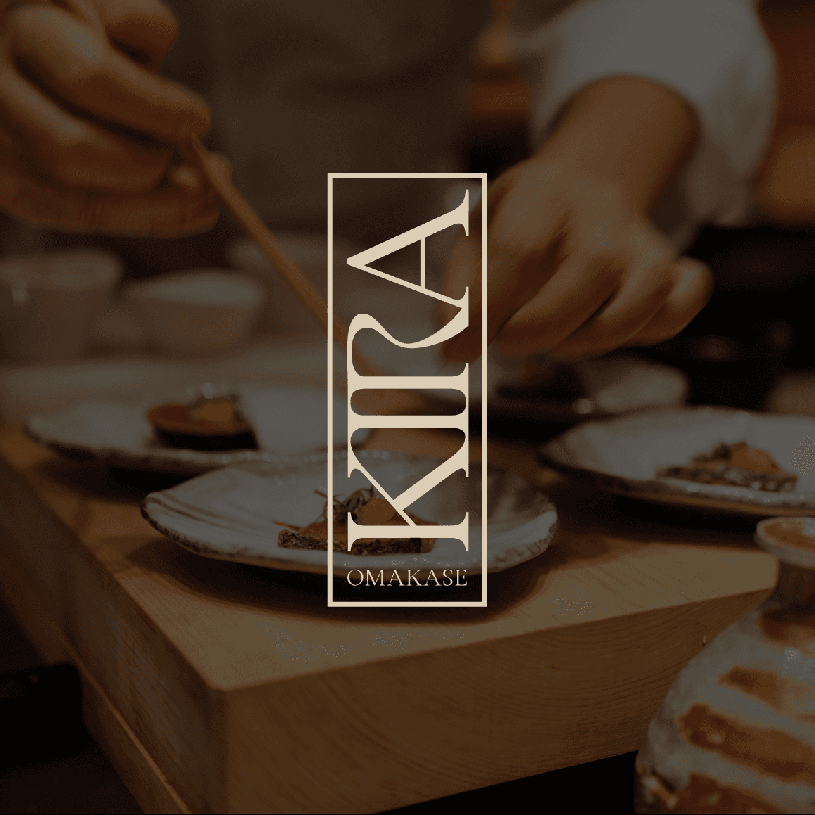 Chef plating omakase courses at the Kira Omakase counter, with the Kira Omakase logo