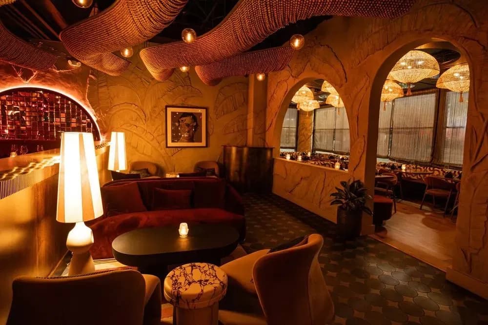 The bar lounge with soft seating and table lamps